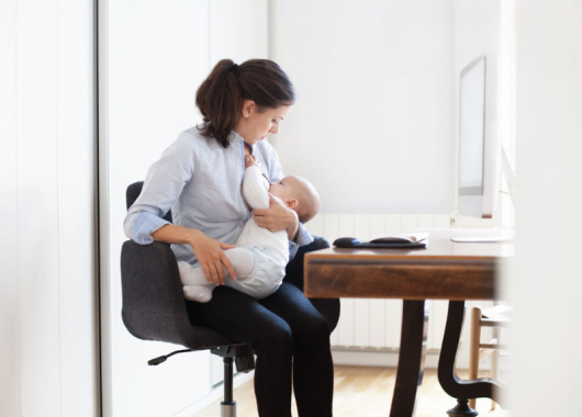 Woman breastfeeding at work