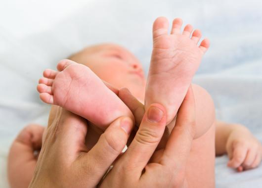 Massaging baby feet