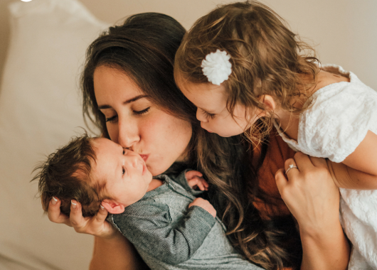 Mother with newborn and toddler