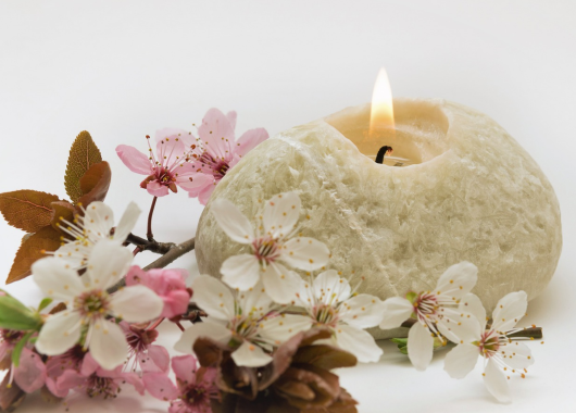 candle and blossoms with ABA logo