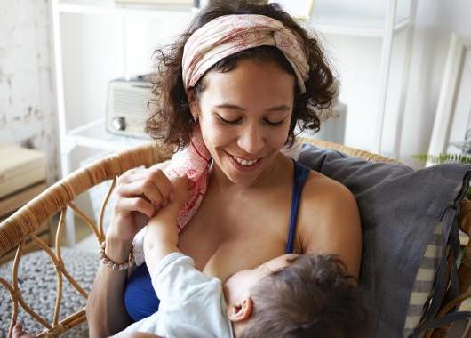 Mother and baby breastfeeding