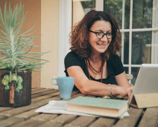 A woman attends an online learning session