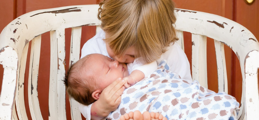 toddler with baby