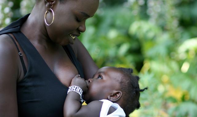 mother feeding toddler