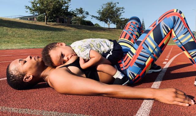 Athlete feeding baby