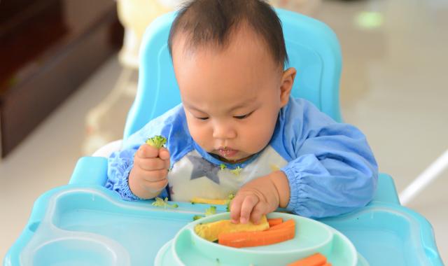 baby in  high chair