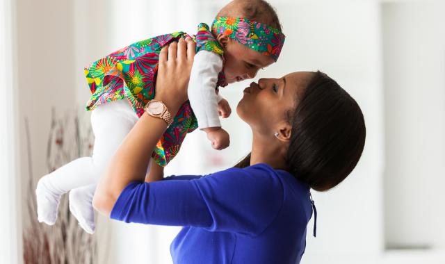 mum holding baby up