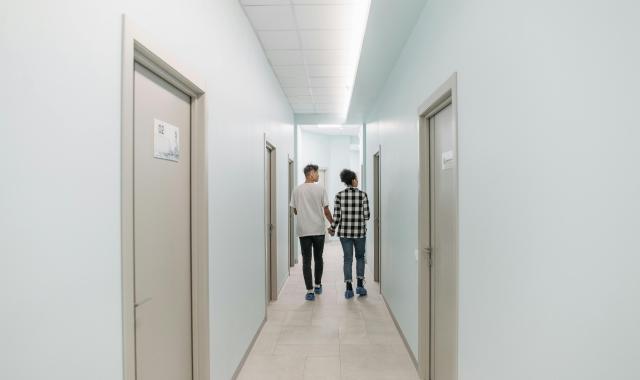 couple walking in clinic hallway