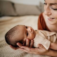 Woman holds newborn baby